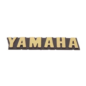 EMBLEMA TANQUE – RX 100/RX115 DORADO